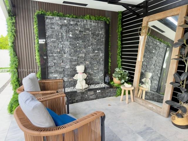9351 Southwest 88th Terrace Miami, FL 33176 - Photo 20 of 73 a view of a patio with couple of chairs and a potted plant