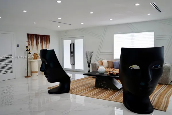 a kitchen with stainless steel appliances kitchen island granite countertop a sink and cabinets