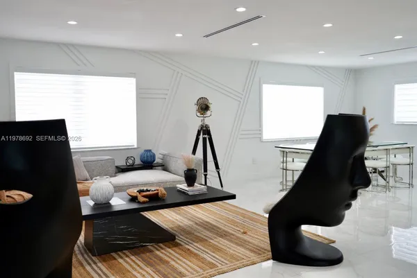 a utility room with sink dryer and washer