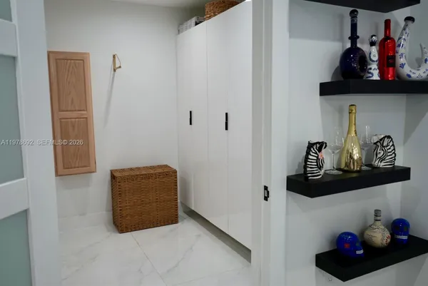 a bathroom with a toilet and a mirror