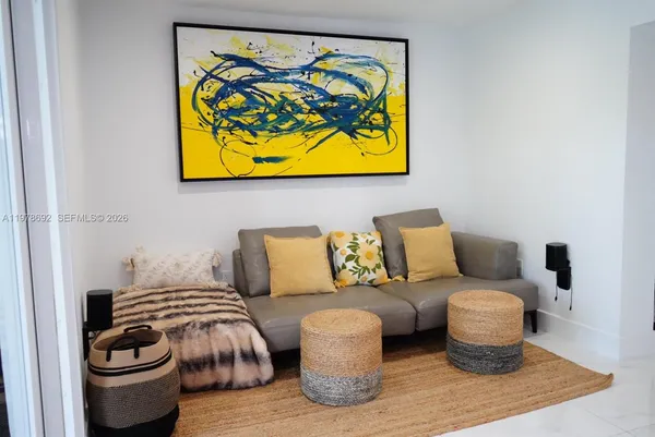 a bathroom with a granite countertop toilet a sink and a mirror