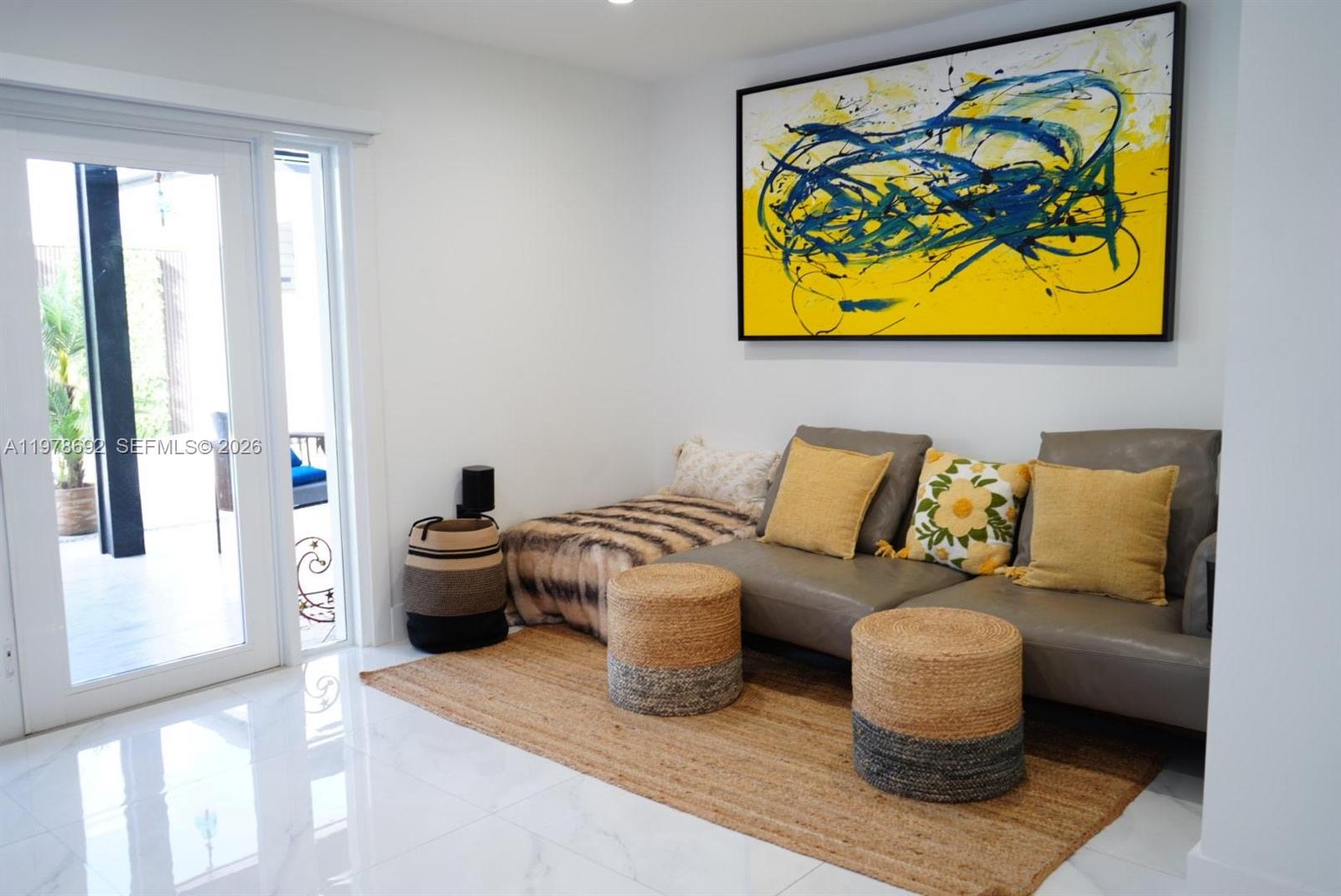 9351 Southwest 88th Terrace Miami, FL 33176 - Photo 36 of 73 a living room with furniture and wall painting