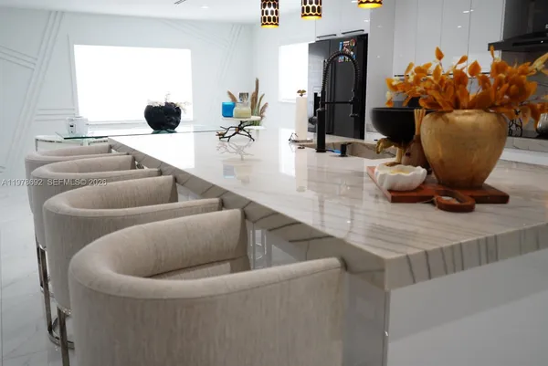 a bedroom with a bed and a potted plant