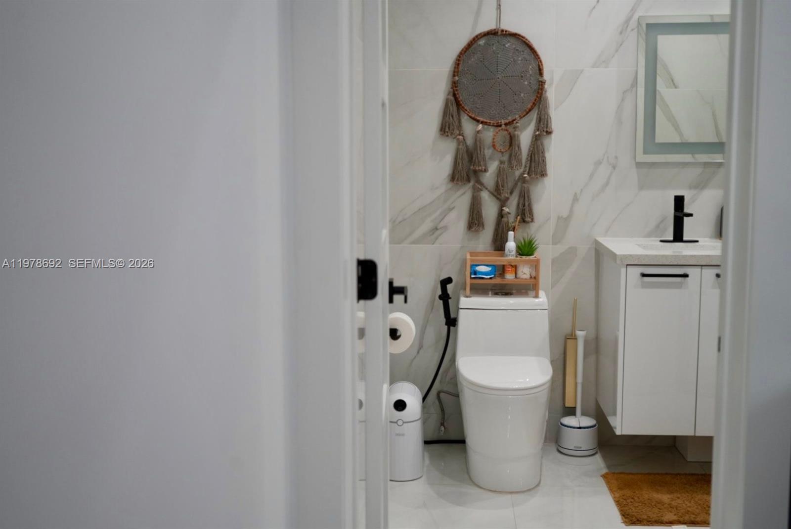 9351 Southwest 88th Terrace Miami, FL 33176 - Photo 45 of 73 a bathroom with a toilet and a mirror
