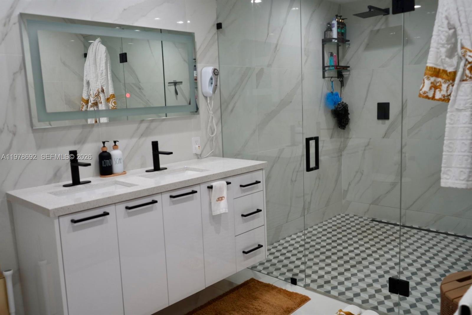 9351 Southwest 88th Terrace Miami, FL 33176 - Photo 46 of 73 a bathroom with a sink and a mirror