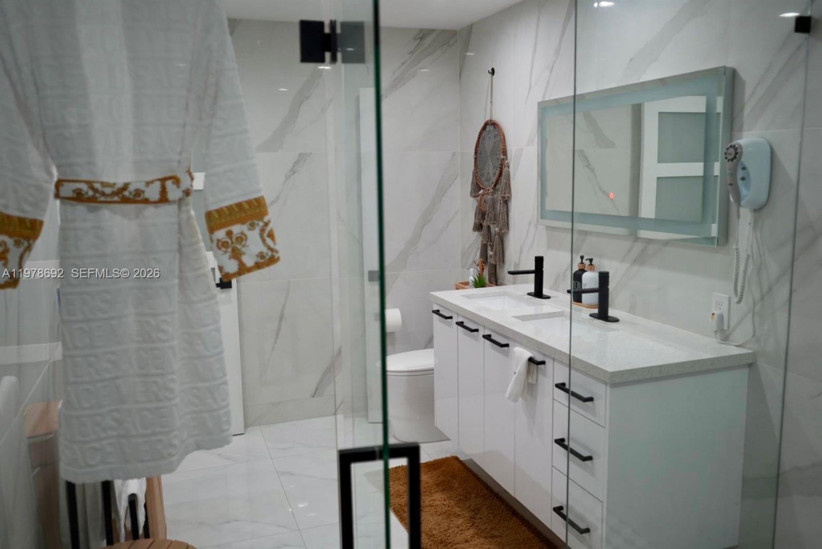 9351 Southwest 88th Terrace Miami, FL 33176 - Photo 51 of 73 a bathroom with a sink vanity and a mirror