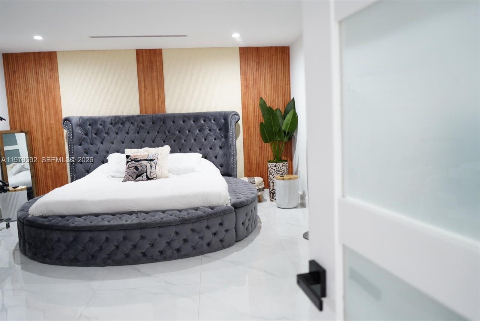 9351 Southwest 88th Terrace Miami, FL 33176 - Photo 55 of 73 a bedroom with a bed and a potted plant