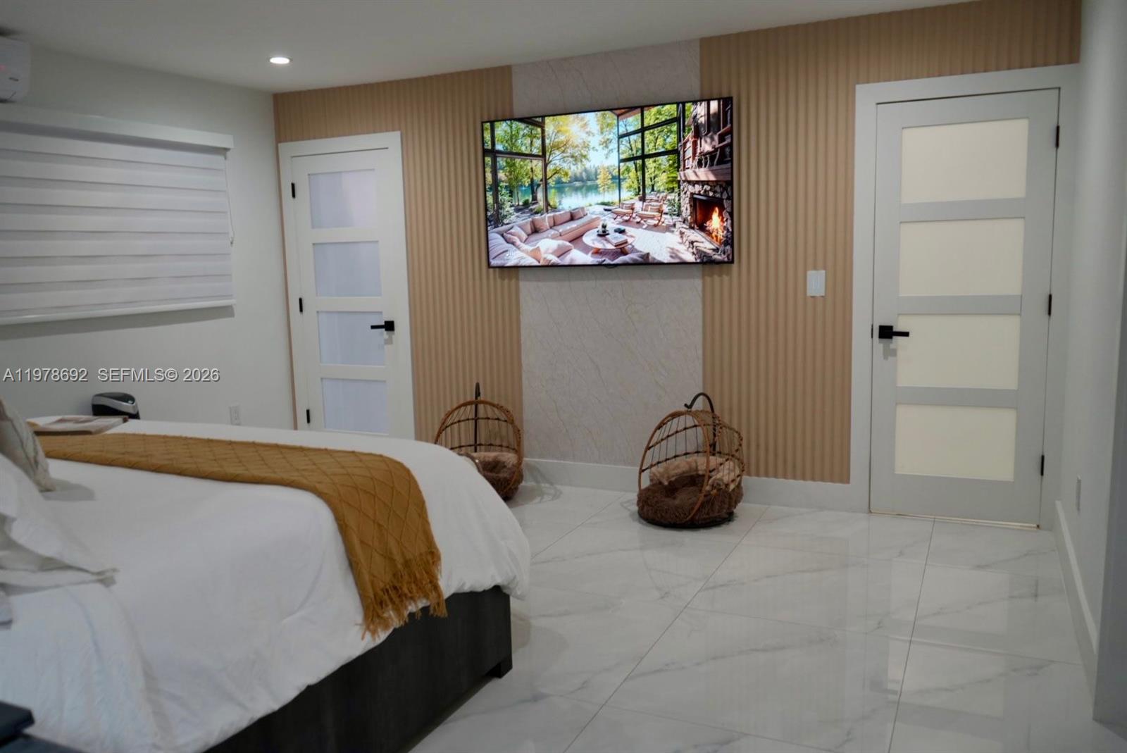 9351 Southwest 88th Terrace Miami, FL 33176 - Photo 57 of 73 a bedroom with a bed and a chandelier