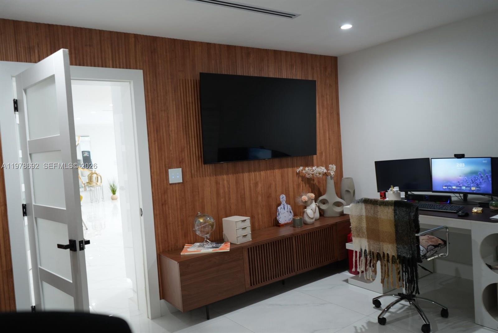 9351 Southwest 88th Terrace Miami, FL 33176 - Photo 60 of 73 a living room with furniture and a flat screen tv