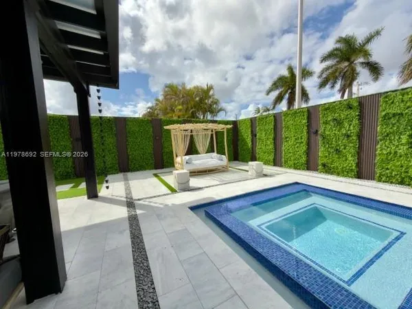 a view of a swimming pool with a lounge chairs