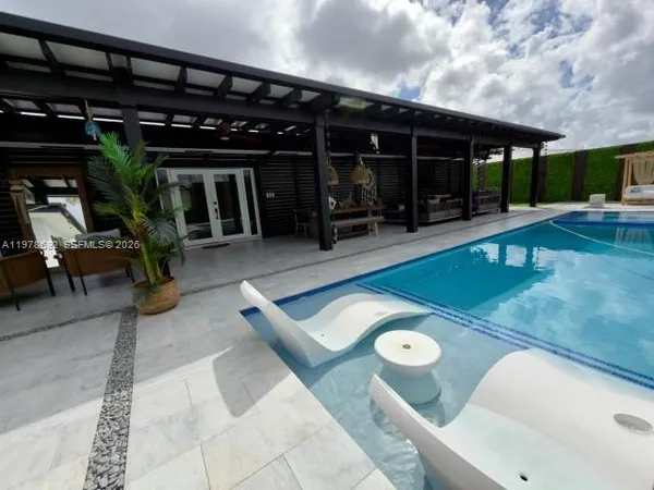 a room with a large window and yard