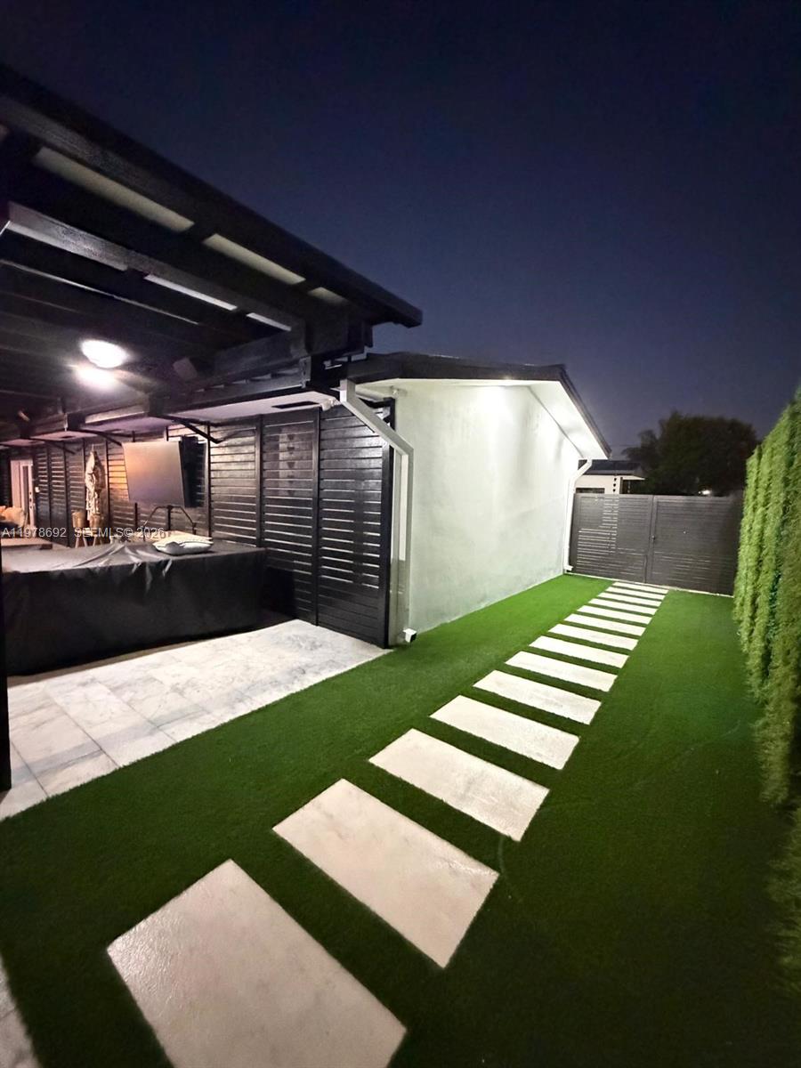 9351 Southwest 88th Terrace Miami, FL 33176 - Photo 71 of 73 a view of a backyard with table and chairs