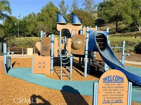 an aerial view of residential houses with outdoor space and parked