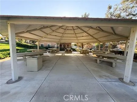 a view of a patio with table and chairs
