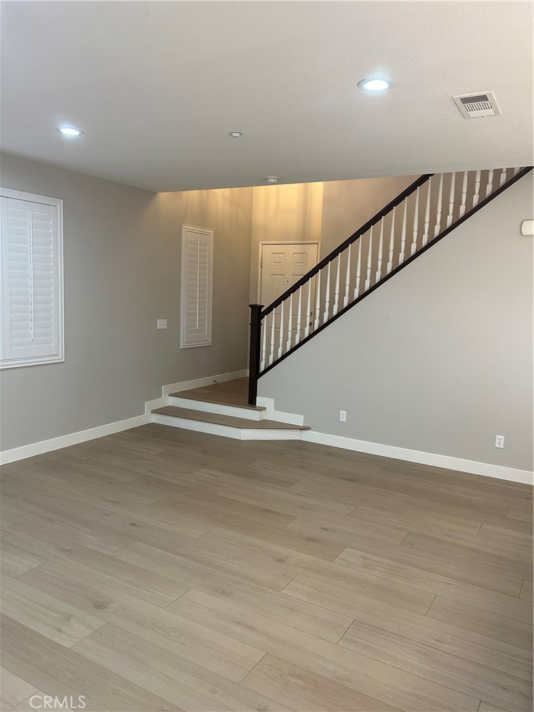 3366 Greenpark Lane Riverside, CA 92503 - Photo 6 of 23 a view of entryway and hall with wooden floor