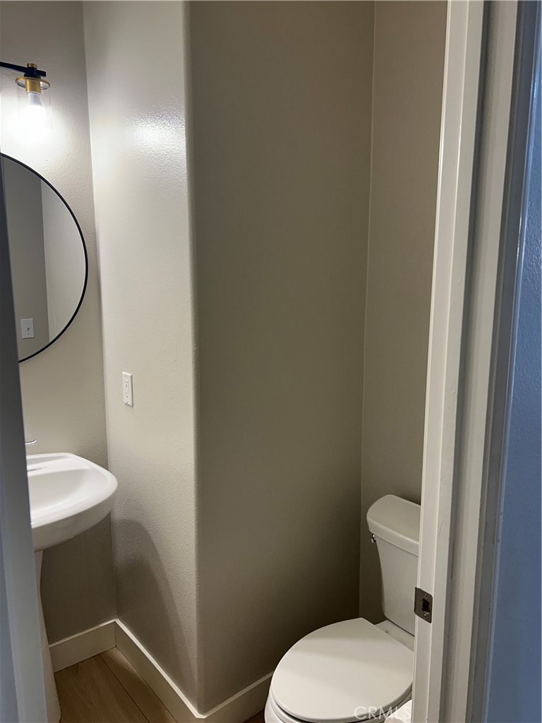 3366 Greenpark Lane Riverside, CA 92503 - Photo 7 of 23 a white toilet sitting next to a shower