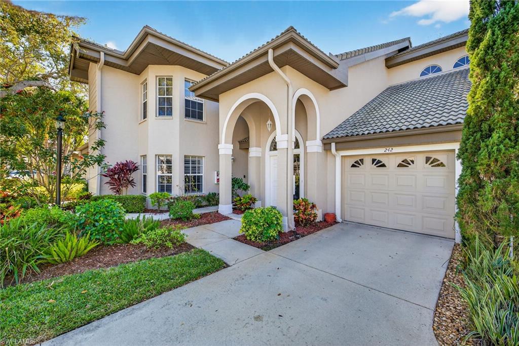 242 Via Perignon, Unit 93 Naples, FL 34119 - Photo 4 of 20 a front view of a house with garden