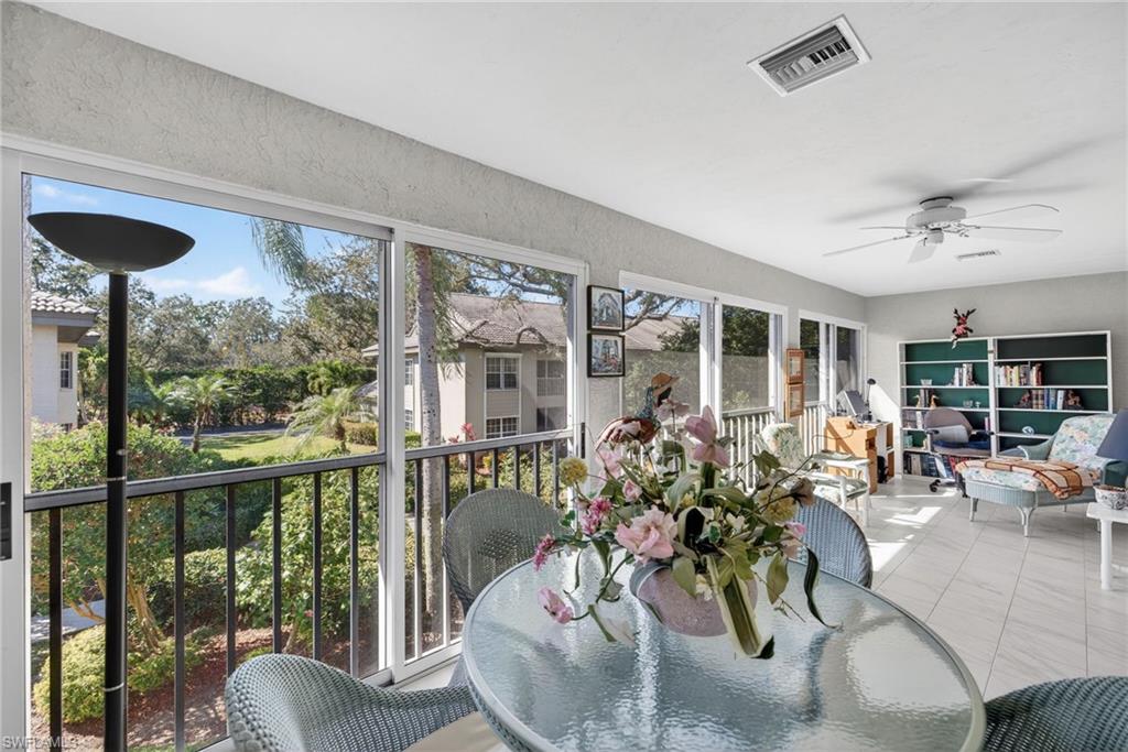 242 Via Perignon, Unit 93 Naples, FL 34119 - Photo 7 of 20 a view of a livingroom with furniture window and wooden floor