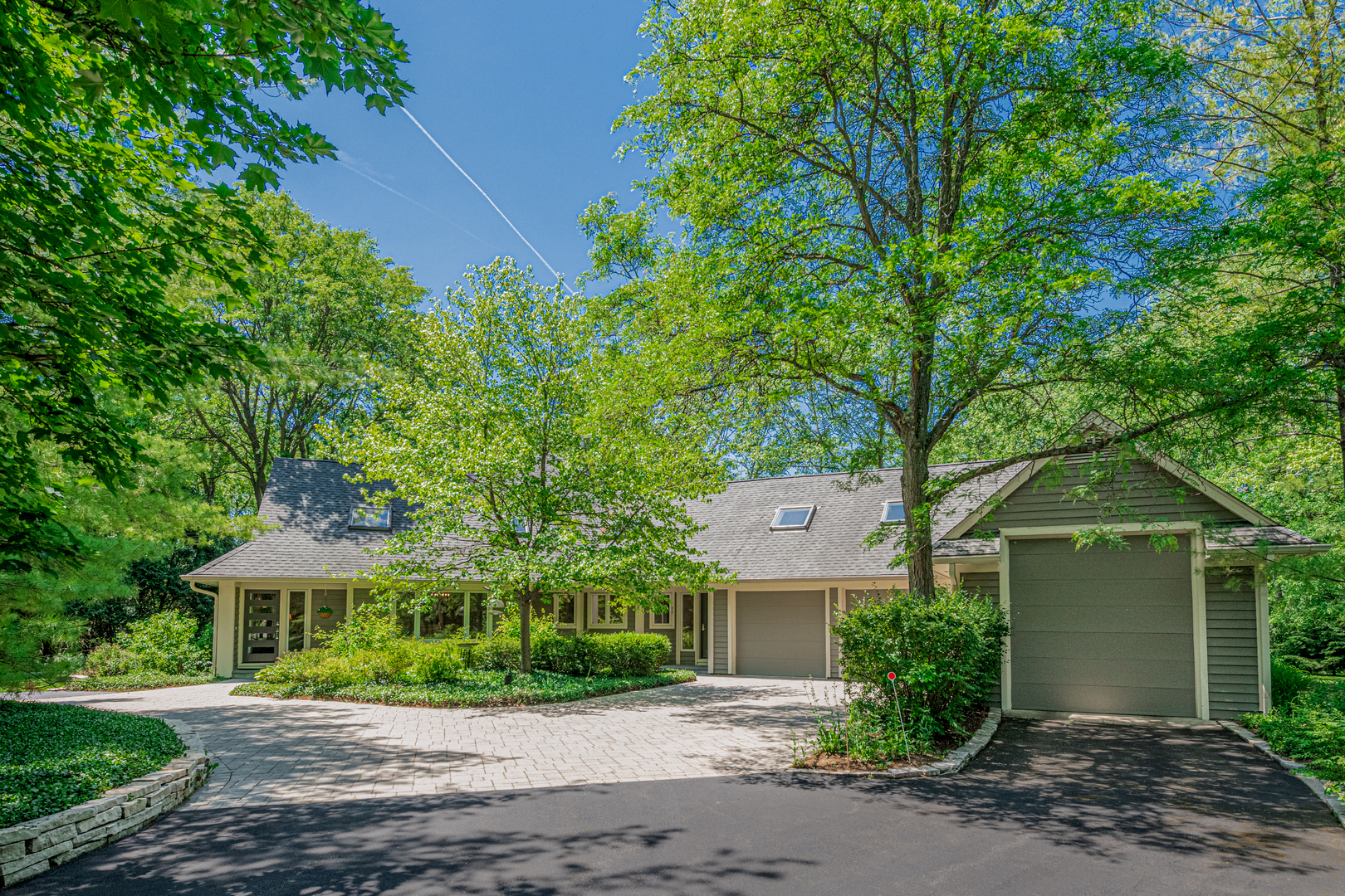 27149 West Cuba Road Barrington, IL 60010 - Photo 1 of 68 a front view of a house with a yard and potted plants