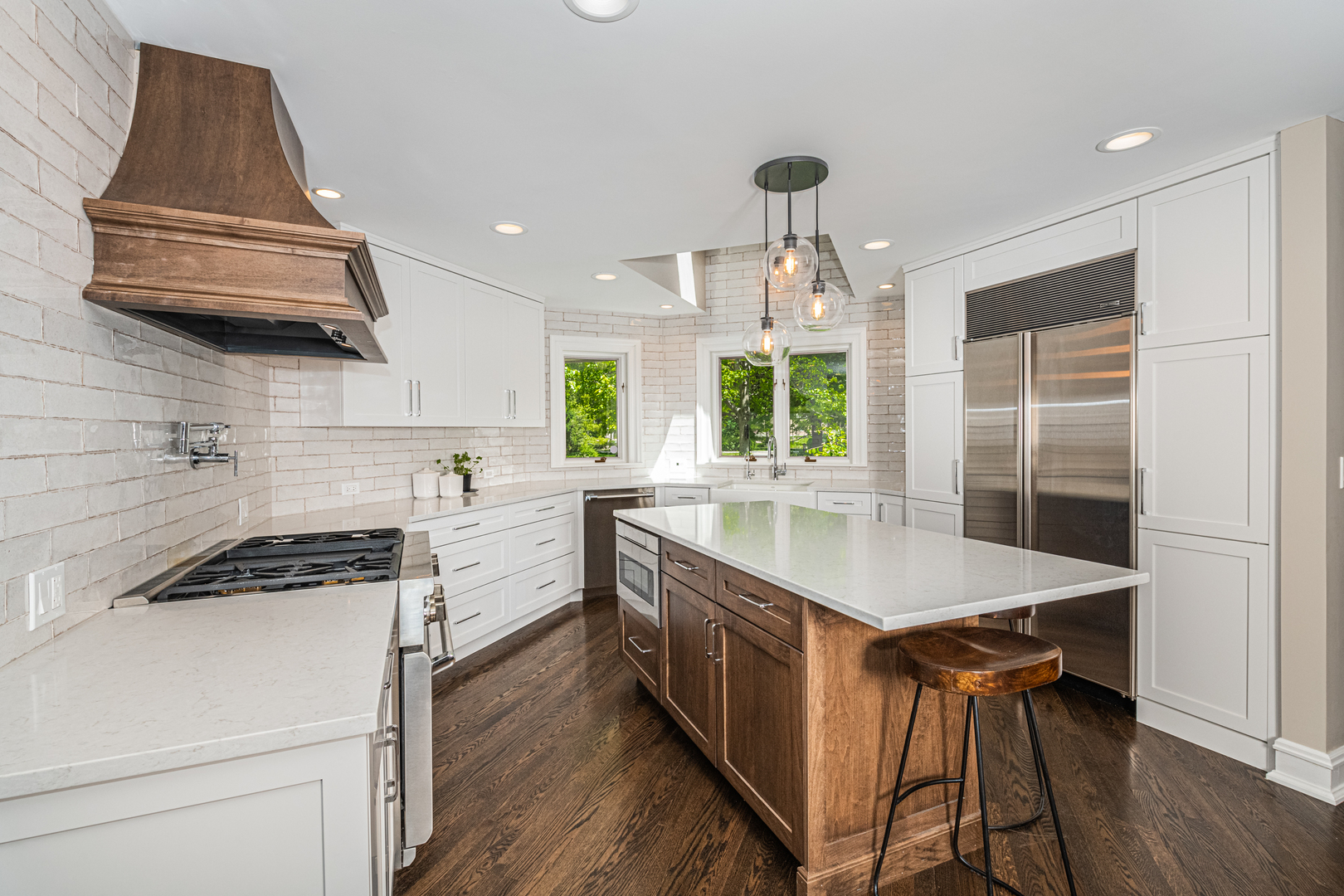 27149 West Cuba Road Barrington, IL 60010 - Photo 16 of 68 a kitchen with stainless steel appliances granite countertop a stove a sink dishwasher and a refrigerator with wooden floor