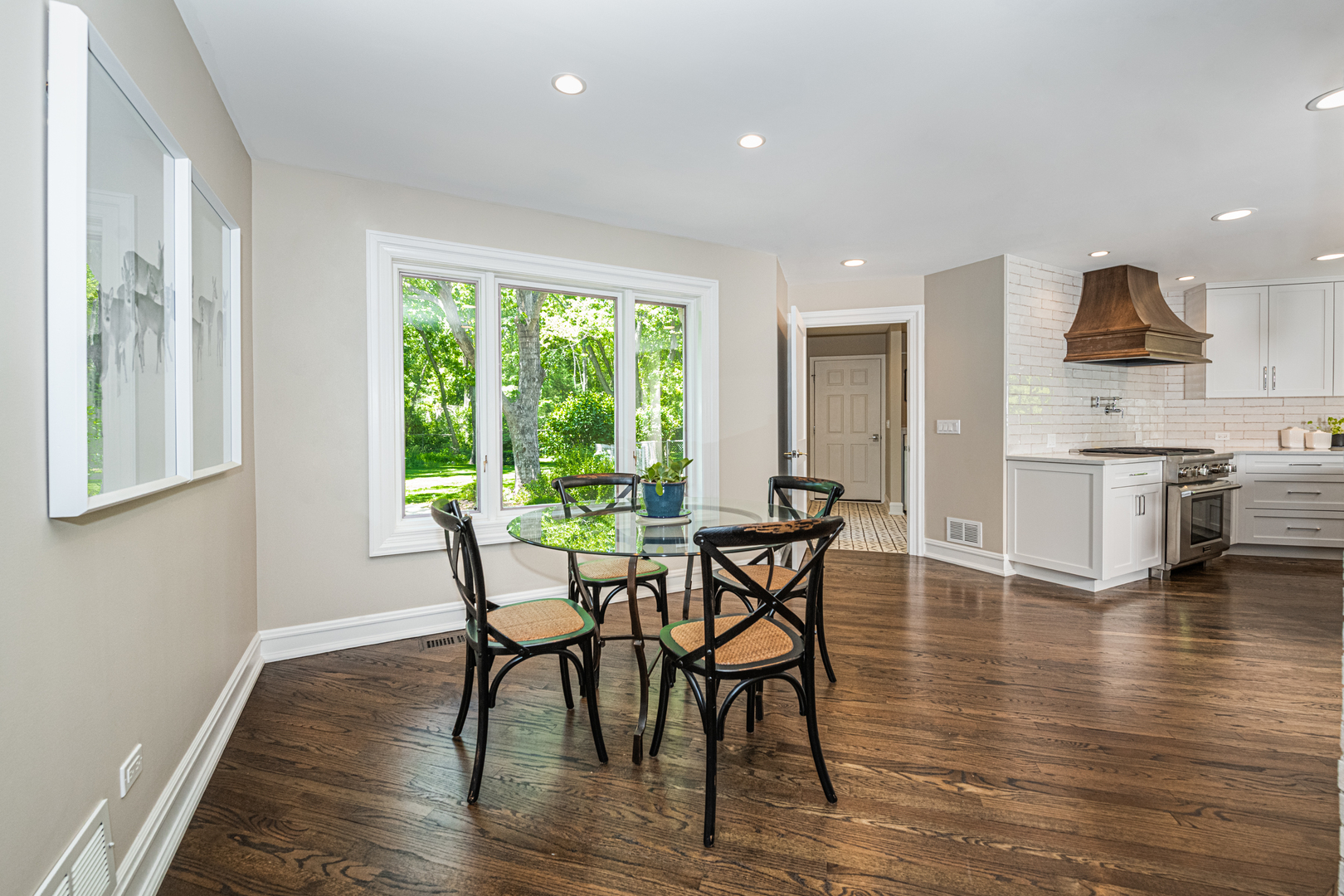 27149 West Cuba Road Barrington, IL 60010 - Photo 18 of 68 a view of a dining room with furniture and wooden floor