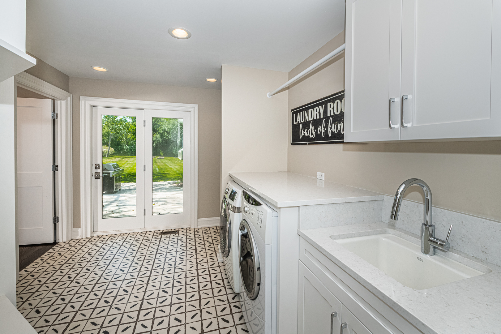 27149 West Cuba Road Barrington, IL 60010 - Photo 20 of 68 a bathroom with a sink a washer and dryer