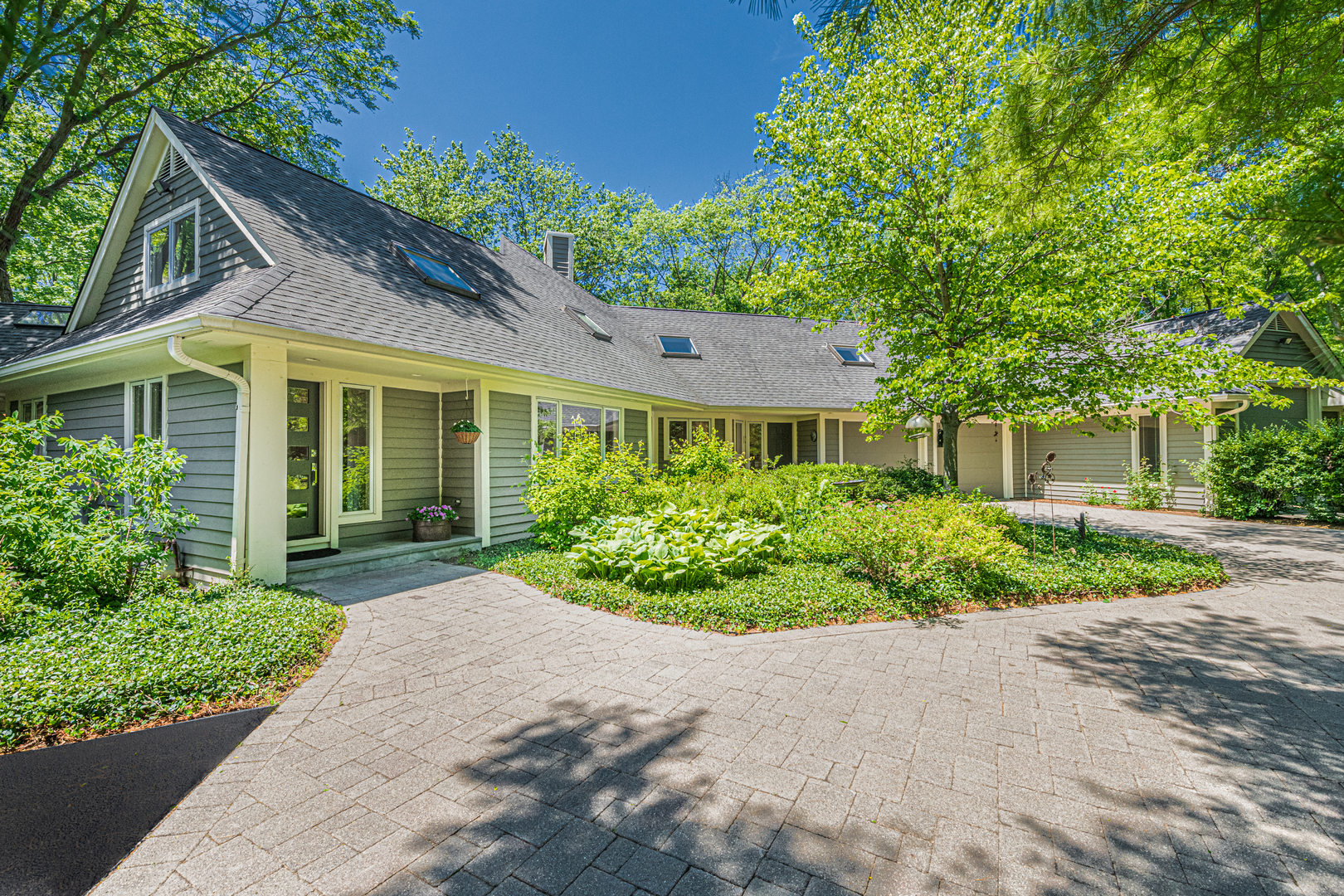 27149 West Cuba Road Barrington, IL 60010 - Photo 3 of 68 a front view of a house with a yard and potted plants