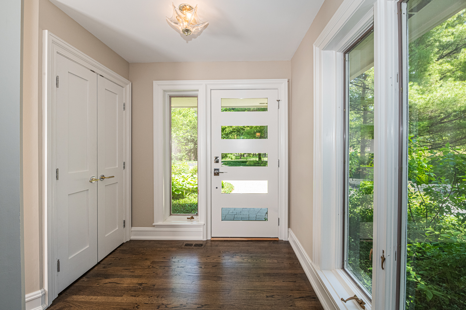 27149 West Cuba Road Barrington, IL 60010 - Photo 4 of 68 a view of an entryway with wooden floor and windows