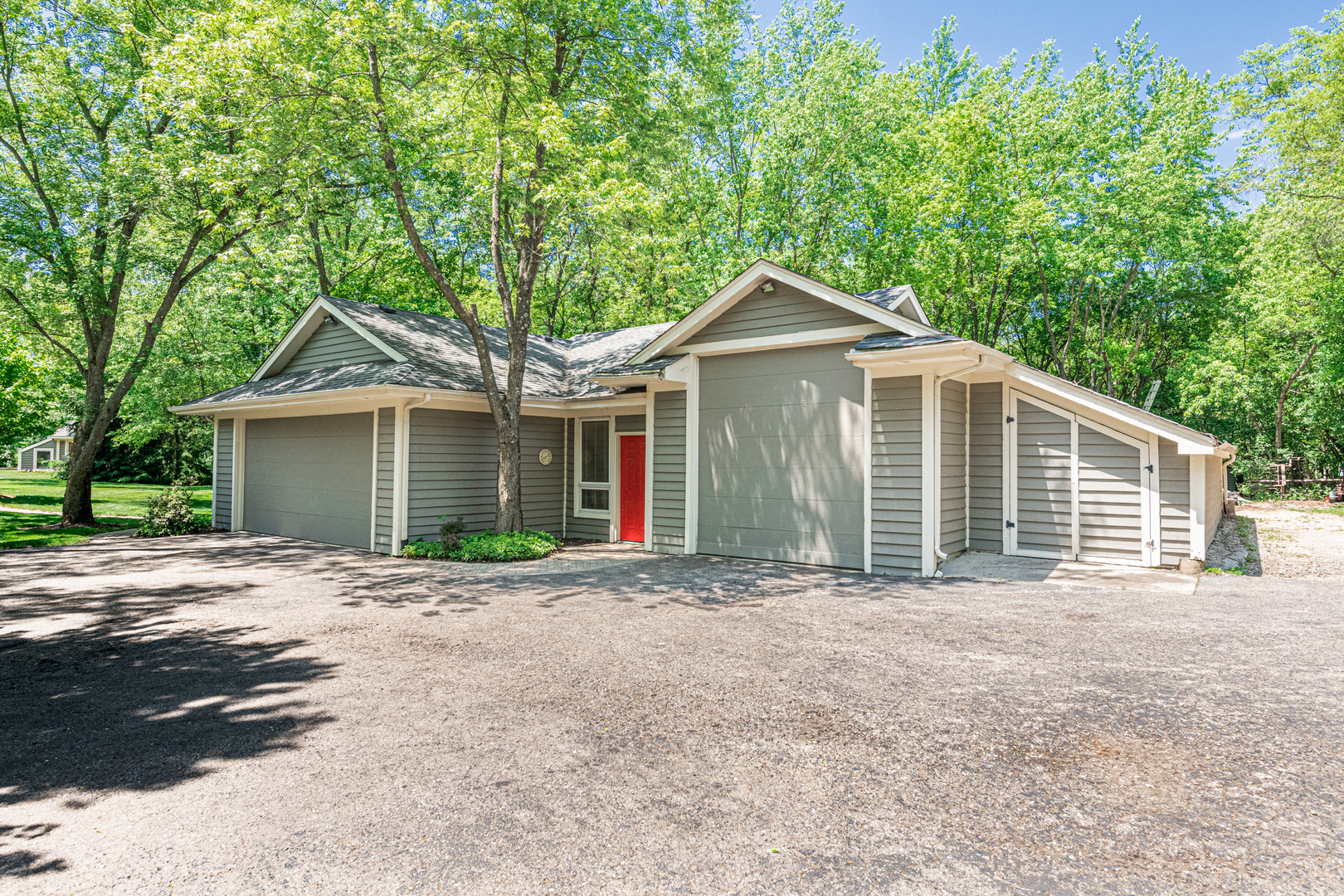 27149 West Cuba Road Barrington, IL 60010 - Photo 55 of 68 a front view of a house with a garden and trees