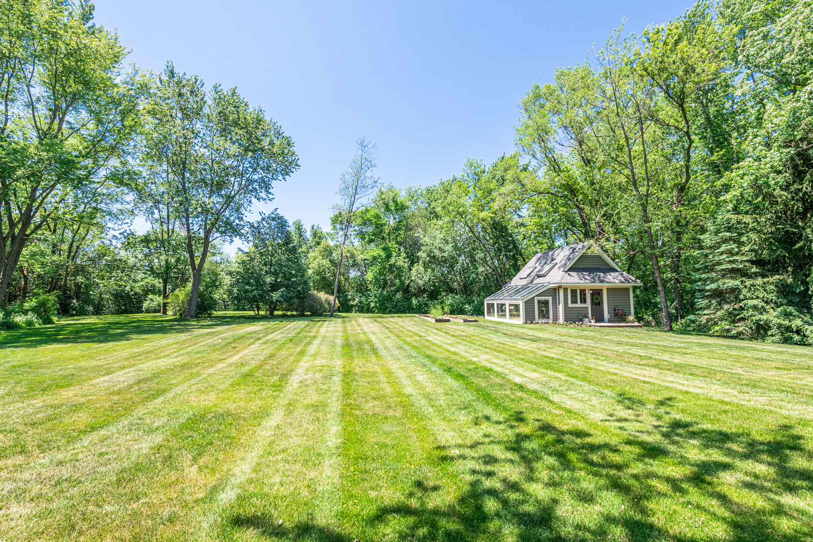 27149 West Cuba Road Barrington, IL 60010 - Photo 58 of 68 a view of a house with a yard and trees