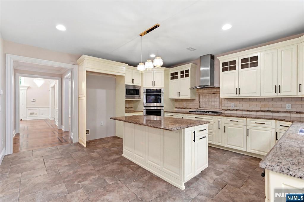 767 Orangeburgh Road River Vale, NJ 07675 - Photo 16 of 49 a kitchen with stainless steel appliances granite countertop a sink and cabinets