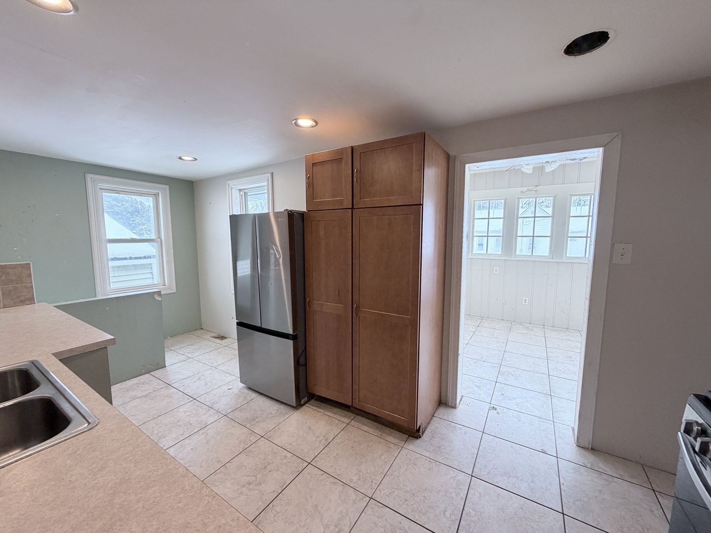 102 East Lincoln Street Pesotum, IL 61863 - Photo 13 of 24 a kitchen with stainless steel appliances granite countertop a refrigerator and a sink