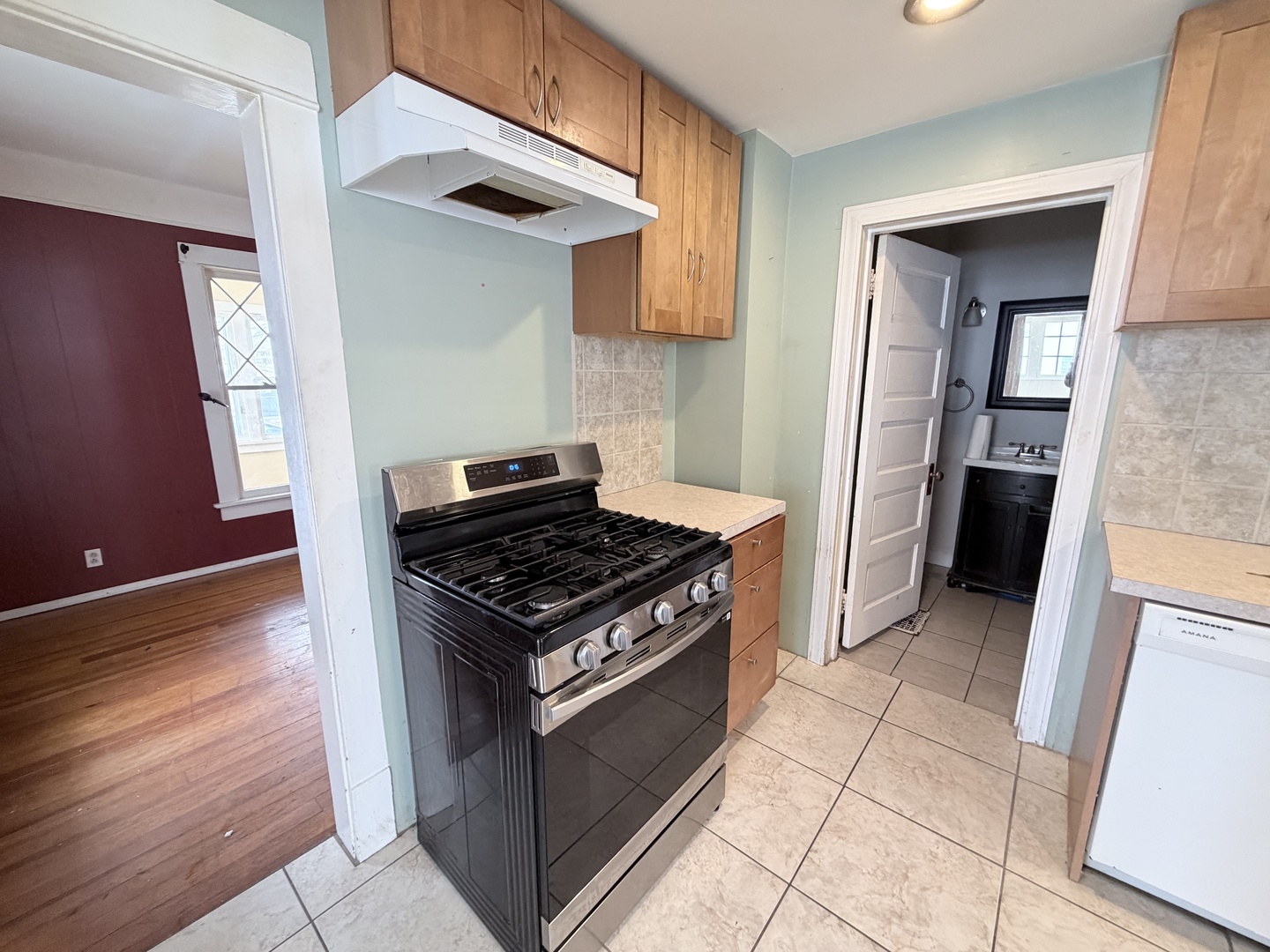 102 East Lincoln Street Pesotum, IL 61863 - Photo 14 of 24 a kitchen with granite countertop a stove and a refrigerator