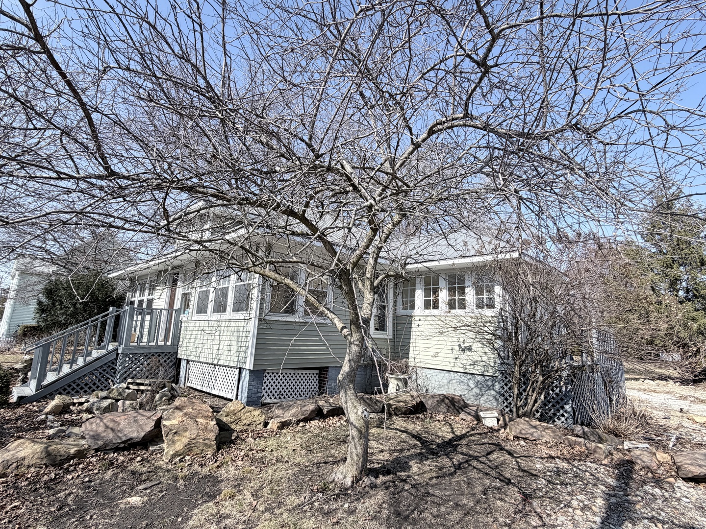 102 East Lincoln Street Pesotum, IL 61863 - Photo 2 of 24 a front view of a house with a yard