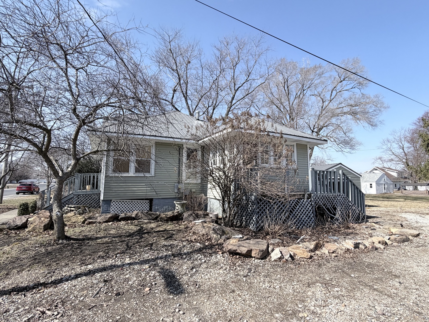 102 East Lincoln Street Pesotum, IL 61863 - Photo 3 of 24 a view of a house with a yard covered in snow