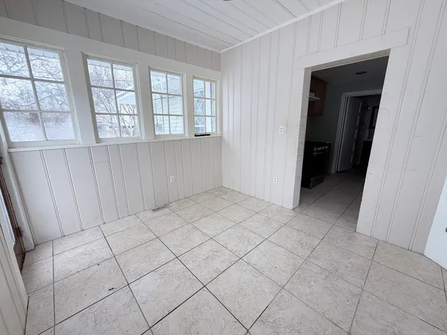 a view of an empty room and window