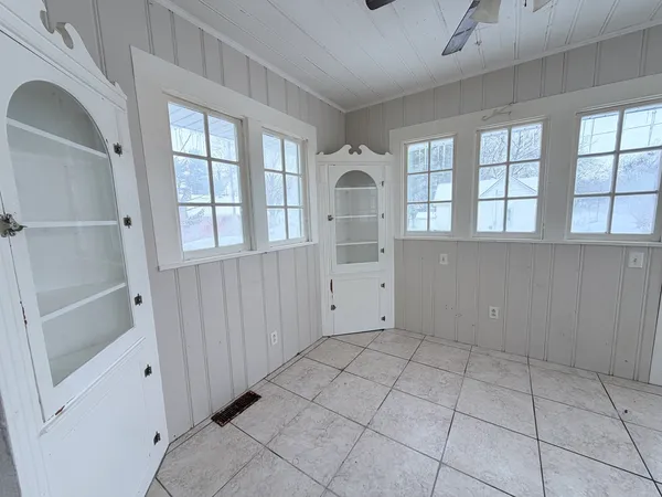 a view of an empty room with a window