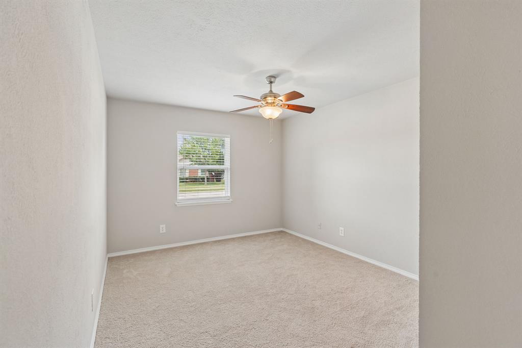 5620 Perrin Street The Colony, TX 75056 - Photo 19 of 31 an empty room with windows and fan