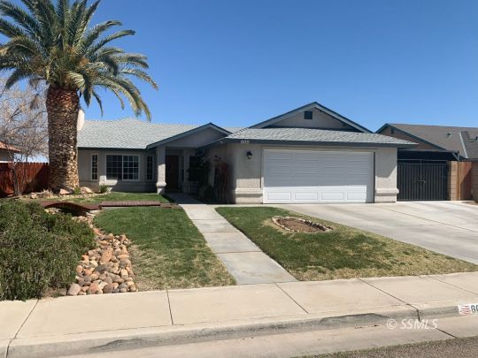 600 South Erin Street Ridgecrest, CA 93555 - Photo 2 of 39 a front view of a house with garden