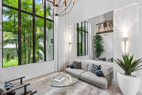 a kitchen with granite countertop a sink stove and refrigerator