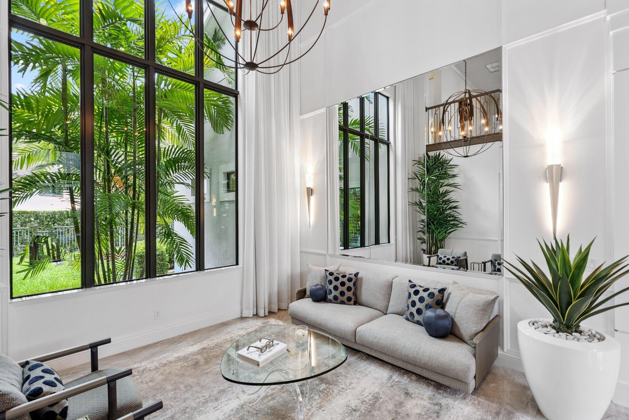 2741 Northwest 70th Boulevard Boca Raton, FL 33496 - Photo 13 of 109 a living room with furniture and a large window