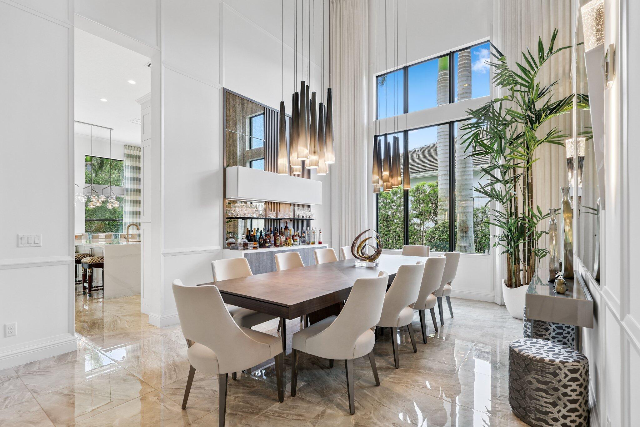 2741 Northwest 70th Boulevard Boca Raton, FL 33496 - Photo 16 of 109 a view of a dining room with furniture window and wooden floor