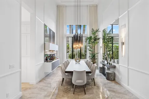 a view of swimming pool with a patio and a garden