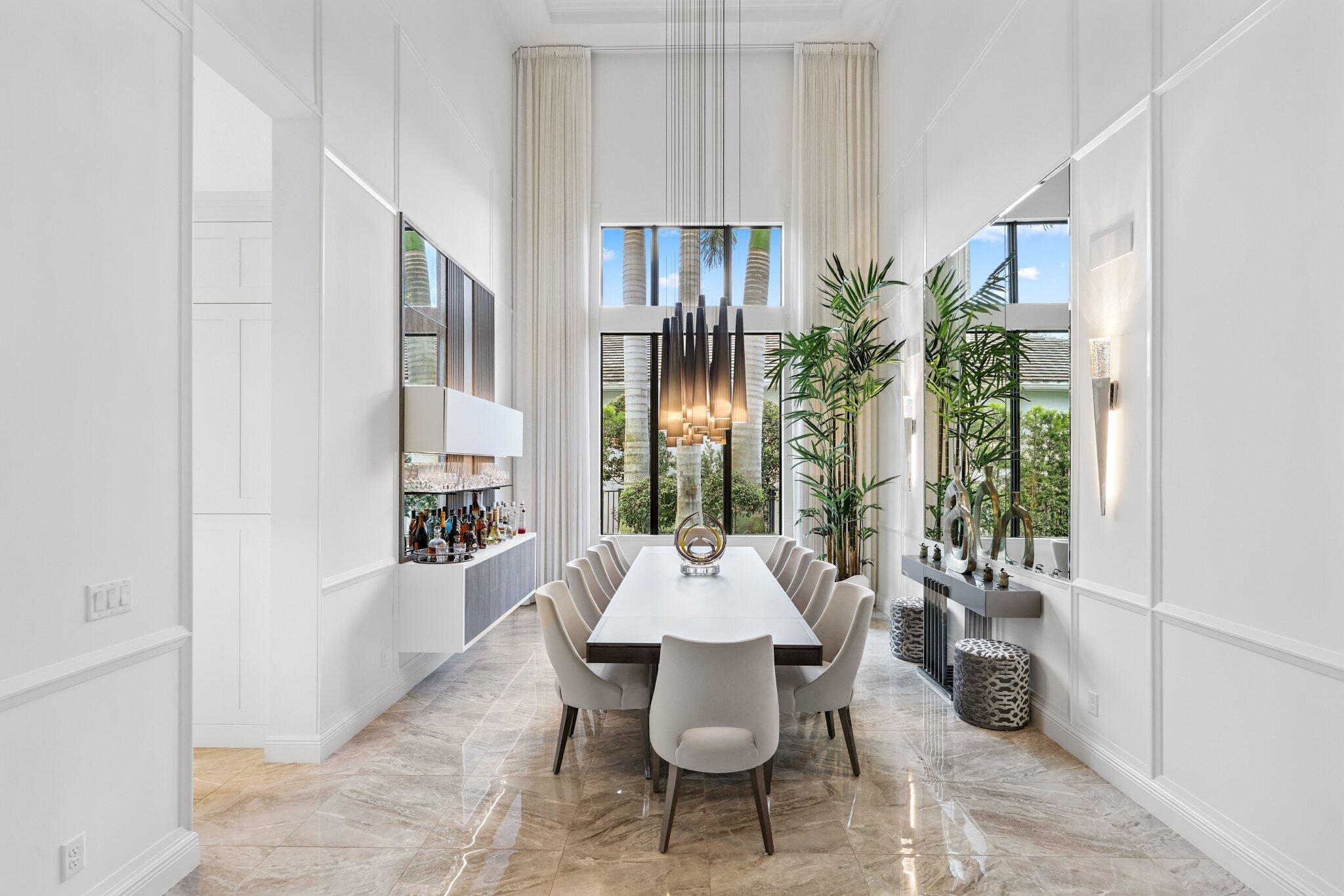 2741 Northwest 70th Boulevard Boca Raton, FL 33496 - Photo 17 of 109 a dining room with furniture and a potted plant