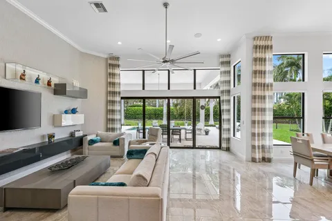 a view of a backyard with a garden and entertaining space