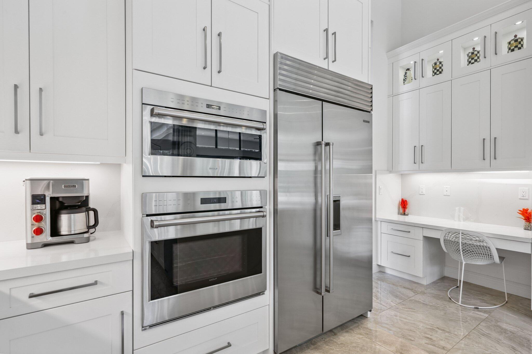 2741 Northwest 70th Boulevard Boca Raton, FL 33496 - Photo 30 of 109 a kitchen with granite countertop cabinets and steel stainless steel appliances