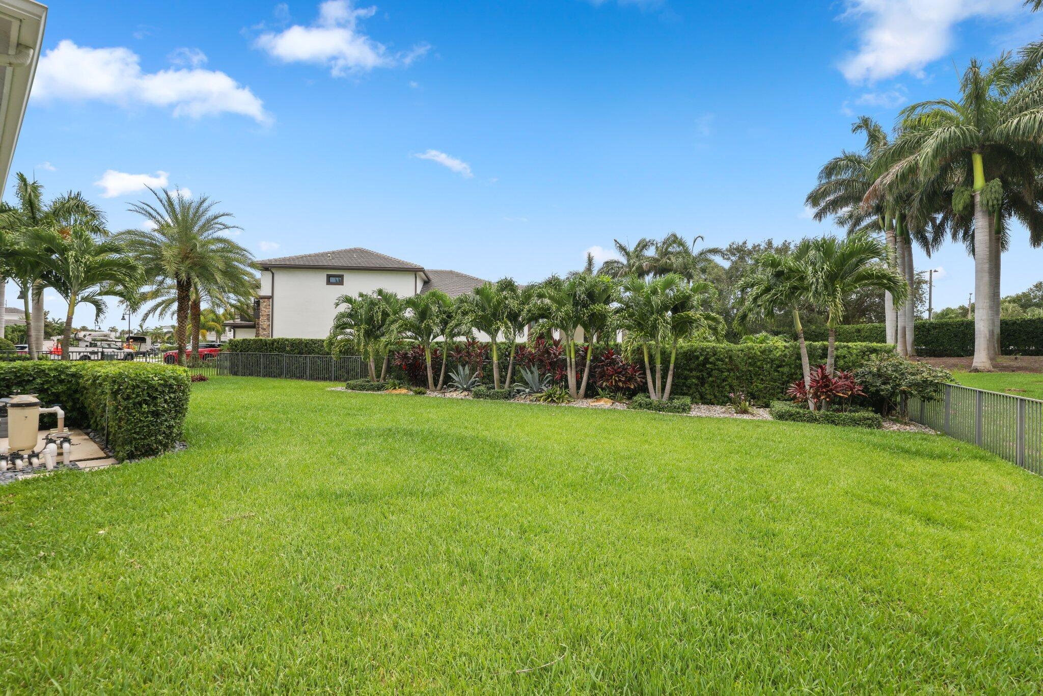 2741 Northwest 70th Boulevard Boca Raton, FL 33496 - Photo 52 of 109 a view of a garden with palm trees