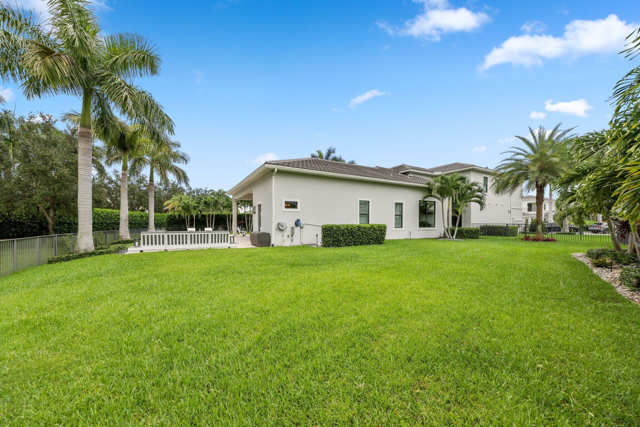 2741 Northwest 70th Boulevard Boca Raton, FL 33496 - Photo 53 of 109 a view of a house with a yard
