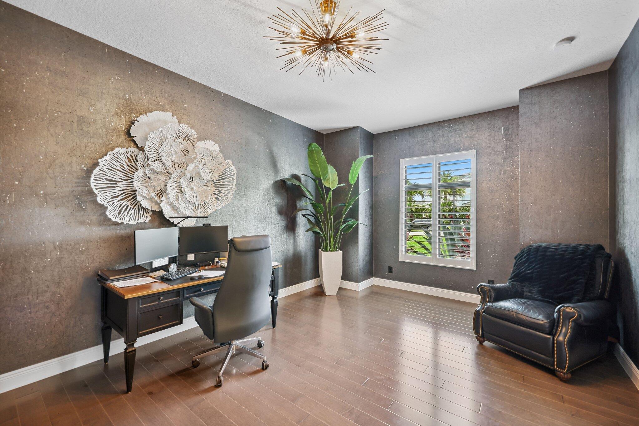 2741 Northwest 70th Boulevard Boca Raton, FL 33496 - Photo 62 of 109 a living room with furniture and a potted plant