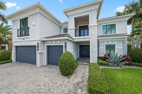 a living room with furniture a flat screen tv and a large window